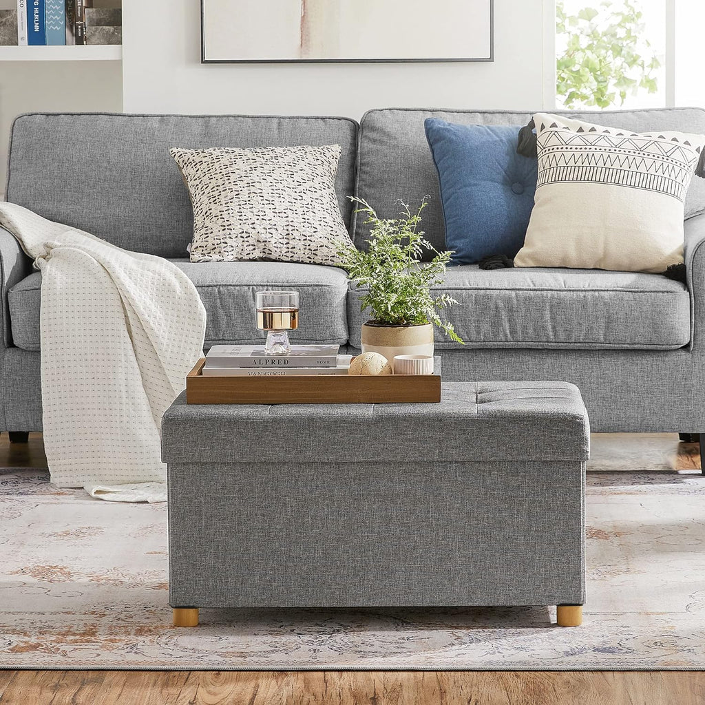 SONGMICS Taburet pliabil cu sezut moale, spatiu de depozitare, maxim 300 kg, 76x38x40 cm, gri deschis