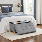 SONGMICS Taburet pliabil cu sezut moale, spatiu de depozitare, maxim 300 kg, 76x38x40 cm, gri deschis