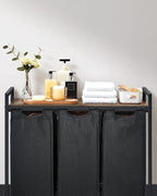 VASAGLE Cos de rufe, 3 compartimente, saci de rufe detasabili, raft, cadru metalic, 3x38L, 93x33x72 cm, maro rustic si negru