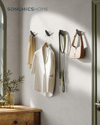 SONGMICS Set 4 carlige perete, design oval din otel, 5 kg per carlig, 9x5x7 cm, negru