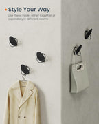 SONGMICS Set 4 carlige perete, design oval din otel, 5 kg per carlig, 9x5x7 cm, negru