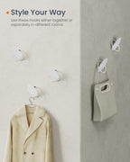 SONGMICS Set 4 carlige perete, design oval din otel, 5 kg per carlig, 9x5x7 cm, alb perlat